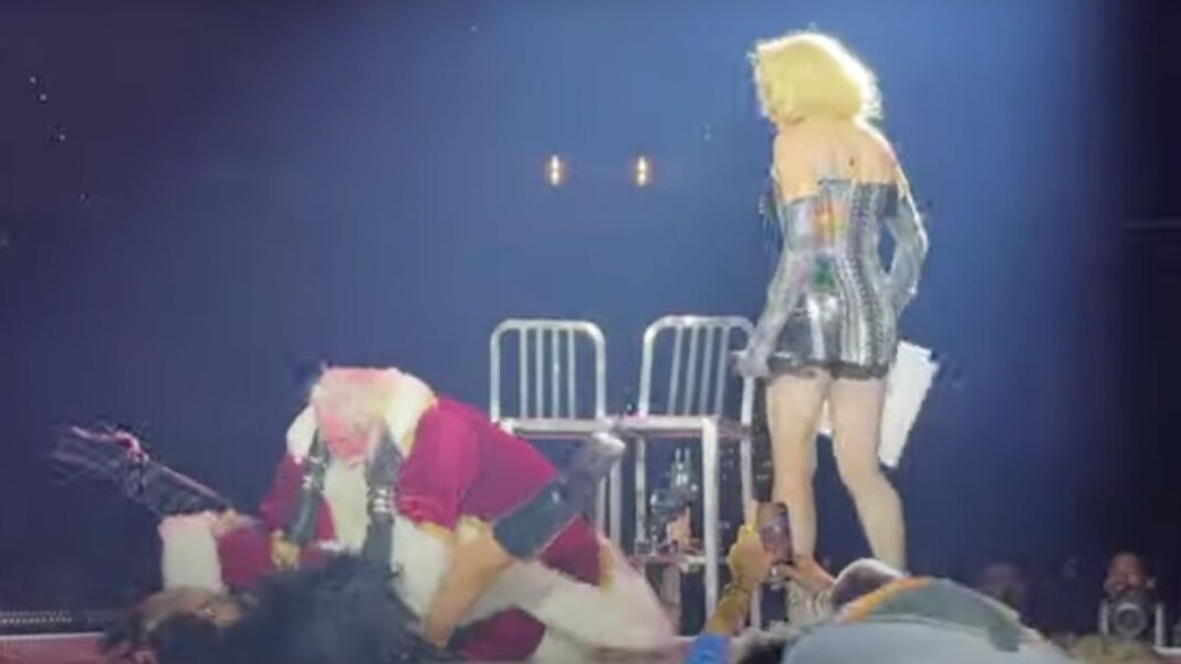 santa-clause-gets-lap-dance-onstage-with-madonna-–-falls-on-dancer